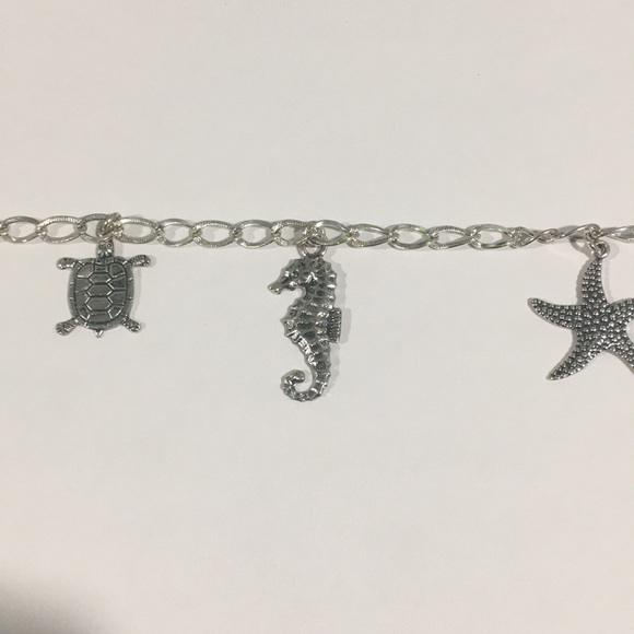 Sterling Silver Bracelet With 7 Different Charms - Picture 6 of 7